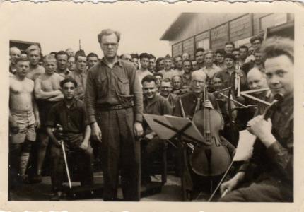 Stalag VIII-A orchestra playing in front of the infirmary; Max is sitting left with his violin
